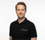 Portrait of a man in a black Saunamo branded polo shirt.